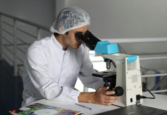 Scientist looking in microscope